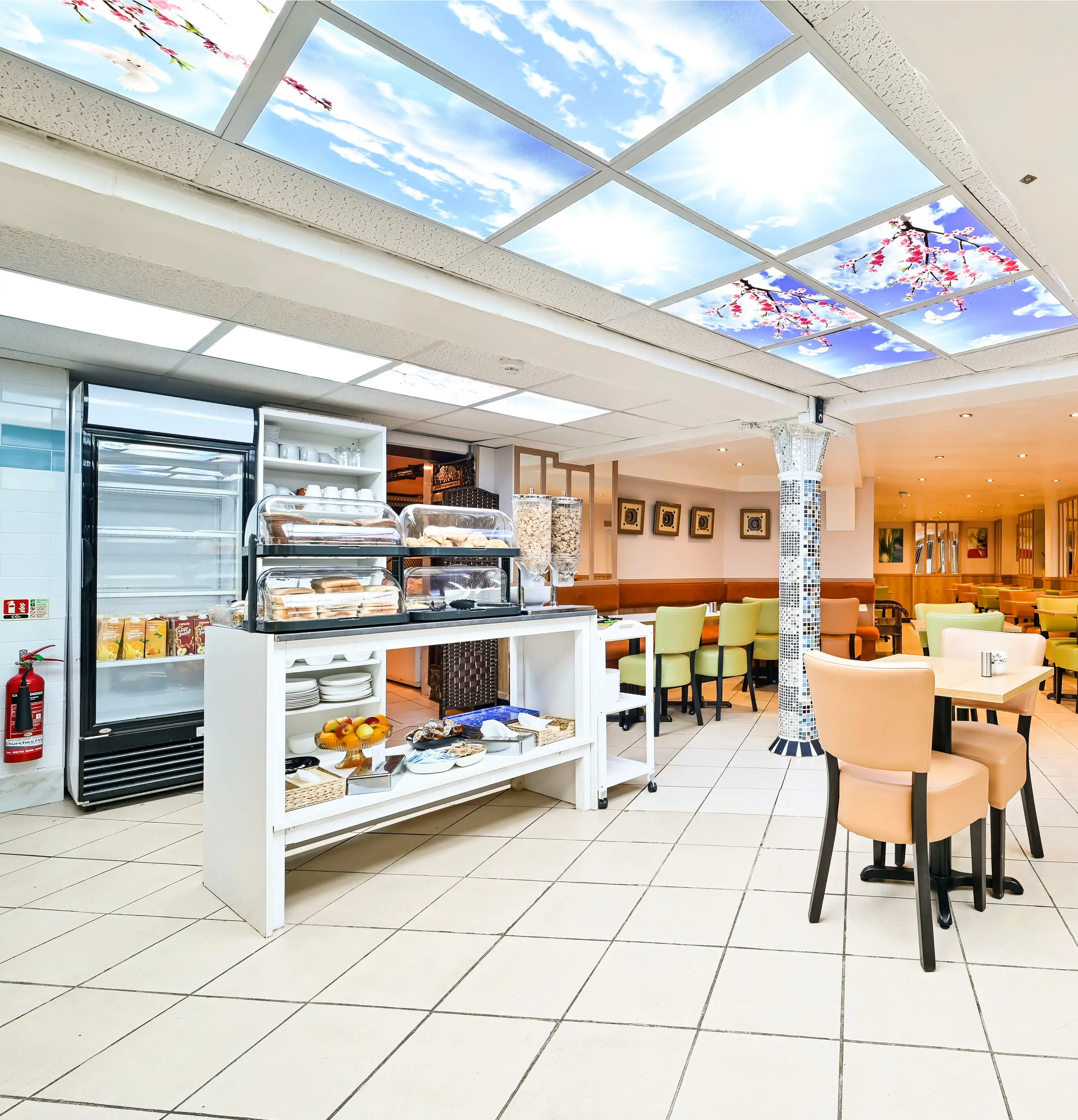 Bright cafe with seating and buffet